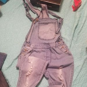 Distressed style over all denim suit